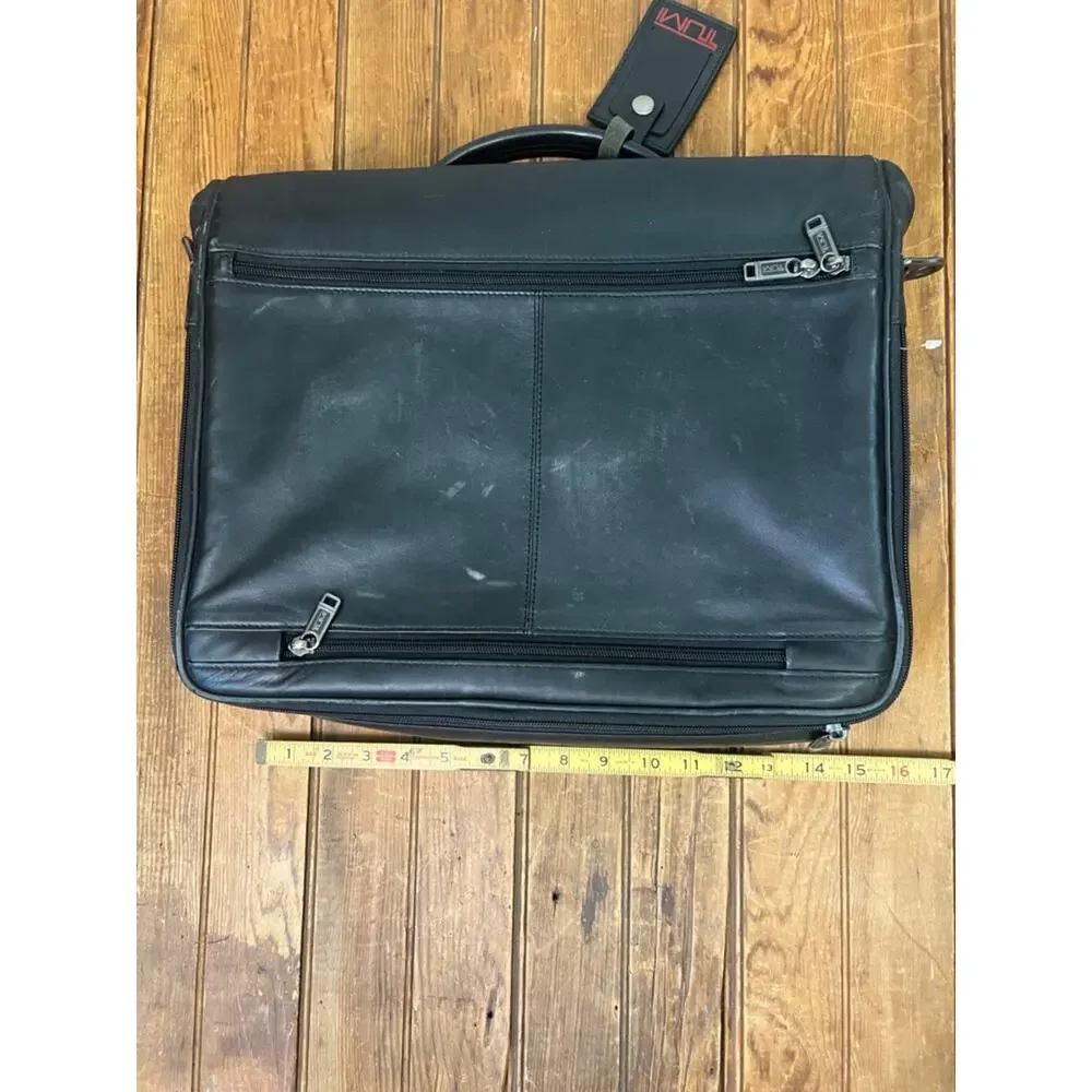 Tumi black leather